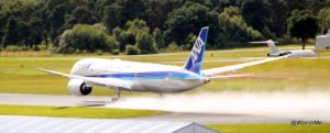 Damp runways make for great spray; the ANA 787 takes off for its Farnborough International Airshow performance