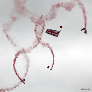 Parachutes open to kick off the flying display on the first day the Farnborough International Airshow was open to the public