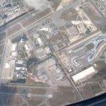 an aerial view of a runway and buildings