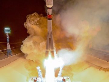 a rocket launching with smoke and fire
