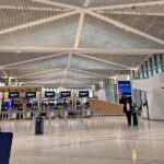 a person walking in a large airport terminal